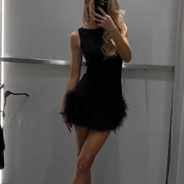 Women wearing Alessia Feather Corset Mini Dress in a neutral background.