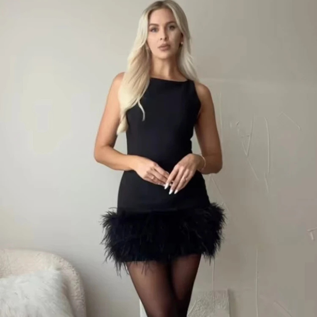Women wearing Alessia Feather Corset Mini Dress in a neutral background.