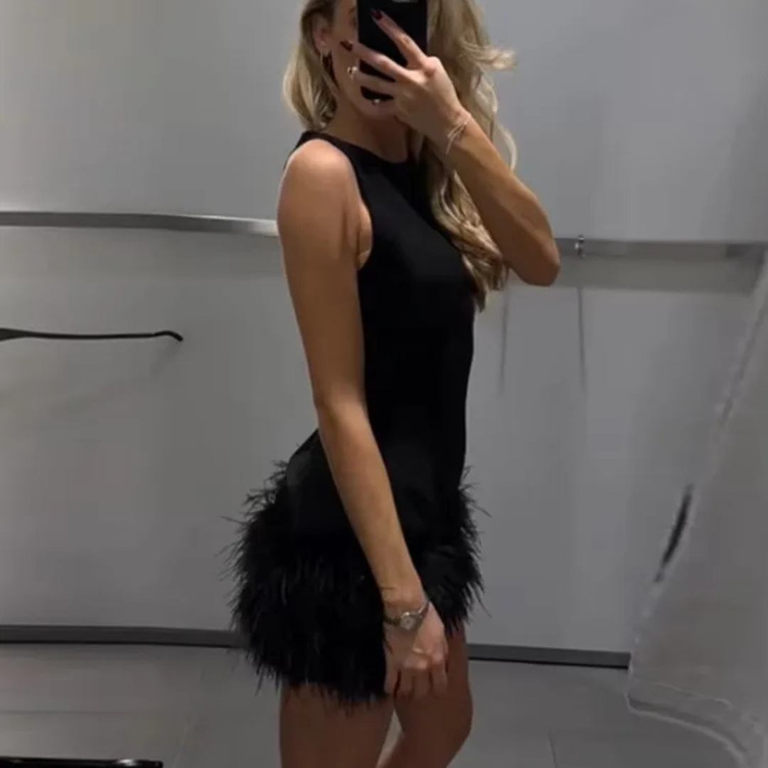 Women wearing Alessia Feather Corset Mini Dress in a neutral background.