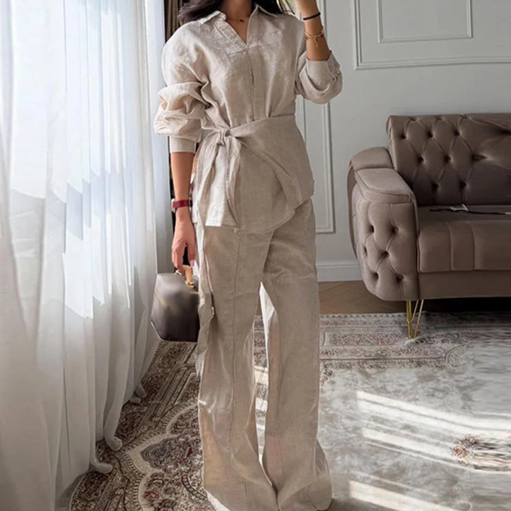 Person wearing a Apricot Alessia Elevated 2-Piece Set outfit in a stylish room with a sofa and rug.