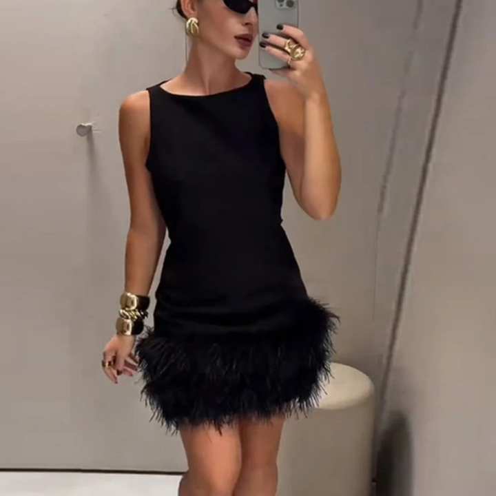 Women wearing Alessia Feather Corset Mini Dress in a neutral background.