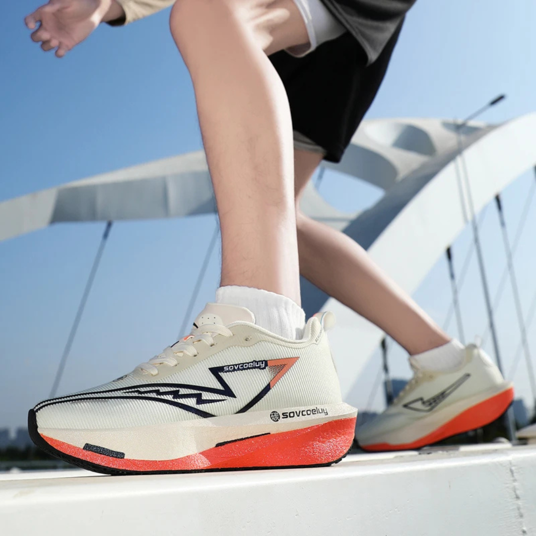 Person wearing white orange Apex Forge Lightweight Marathon Sneakers on a boat