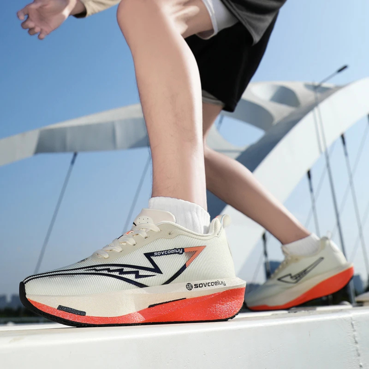 Person wearing white orange Apex Forge Lightweight Marathon Sneakers on a boat