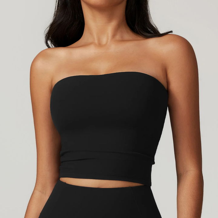 Black Aria Strapless Fitness Top worn by a person on a plain background