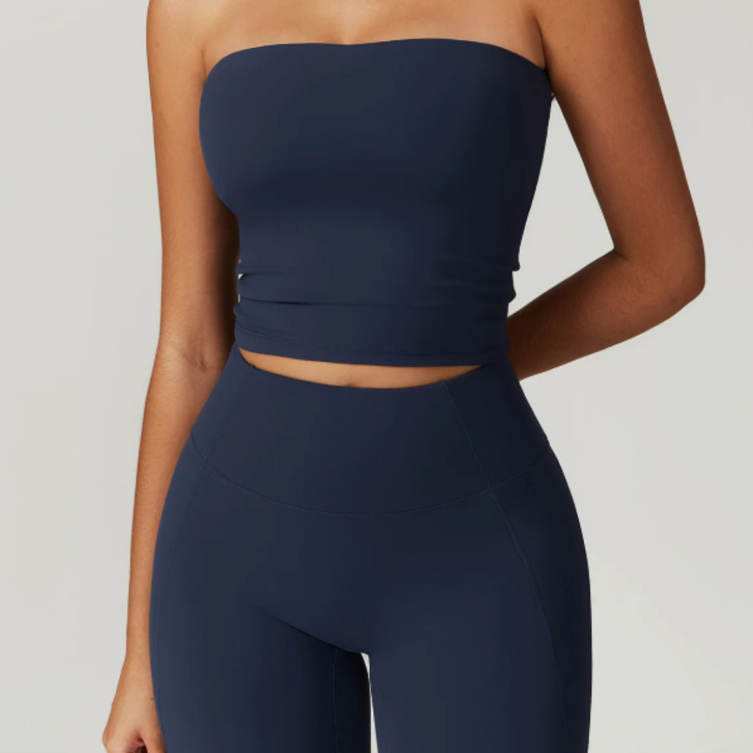 Blue Aria Strapless Fitness Top and leggings on a neutral background