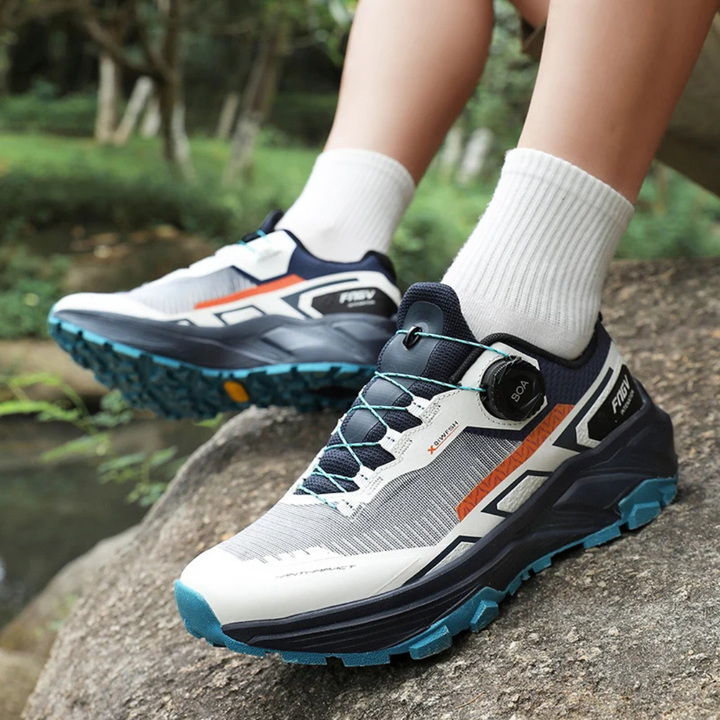 Person wearing dark blue running shoes on a natural background.