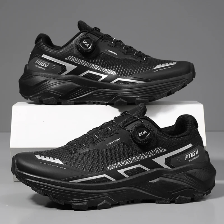 Black running shoes on a gray background
