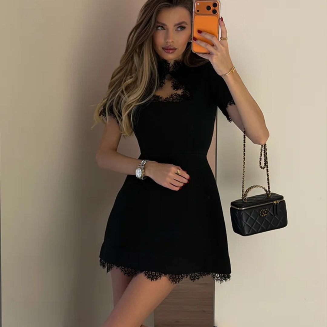 Woman wearing a Atelier Noir Patchwork Mini Dress in a neutral background.