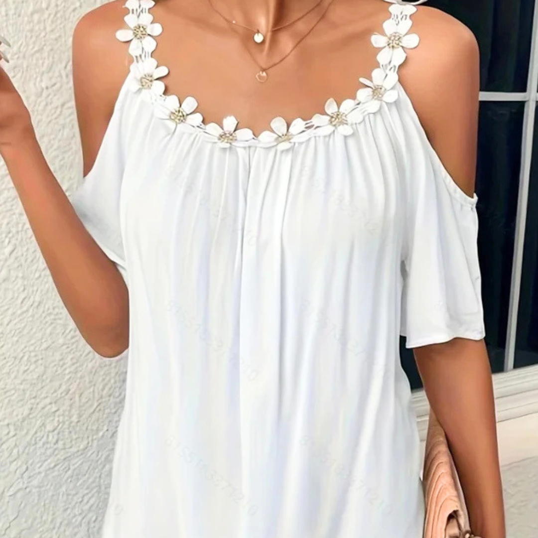 White floral dress with a neutral background