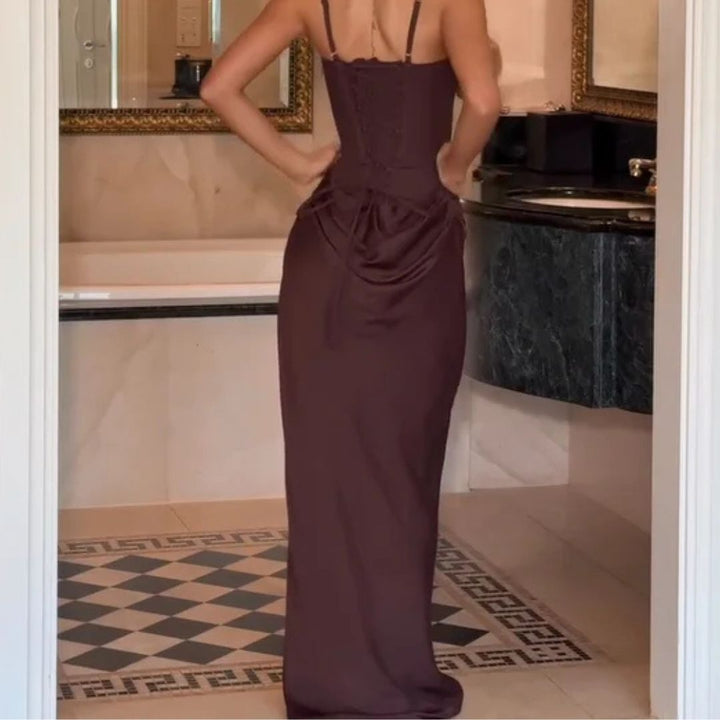 Woman wearing evening gown in a bathroom setting
