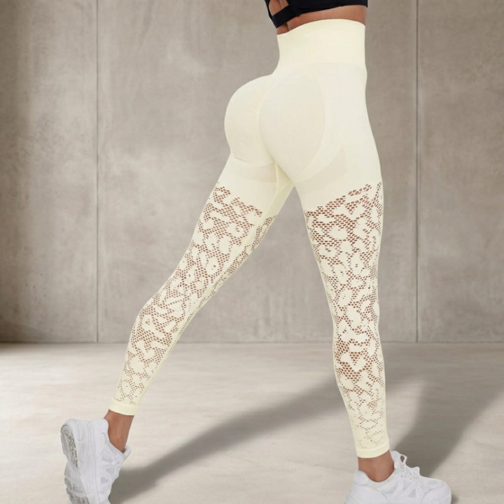 White leggings with lace details on a neutral background