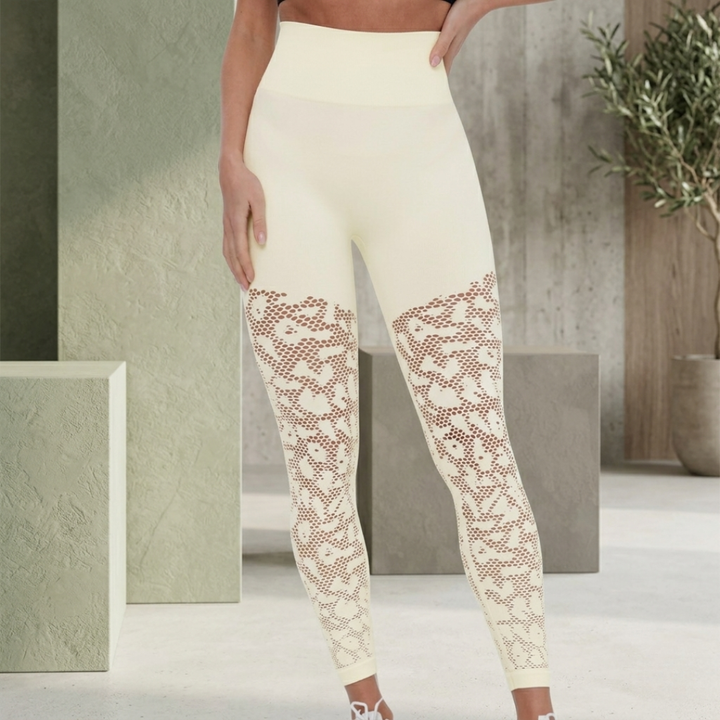 White leggings with lace details worn by a person in an indoor setting.