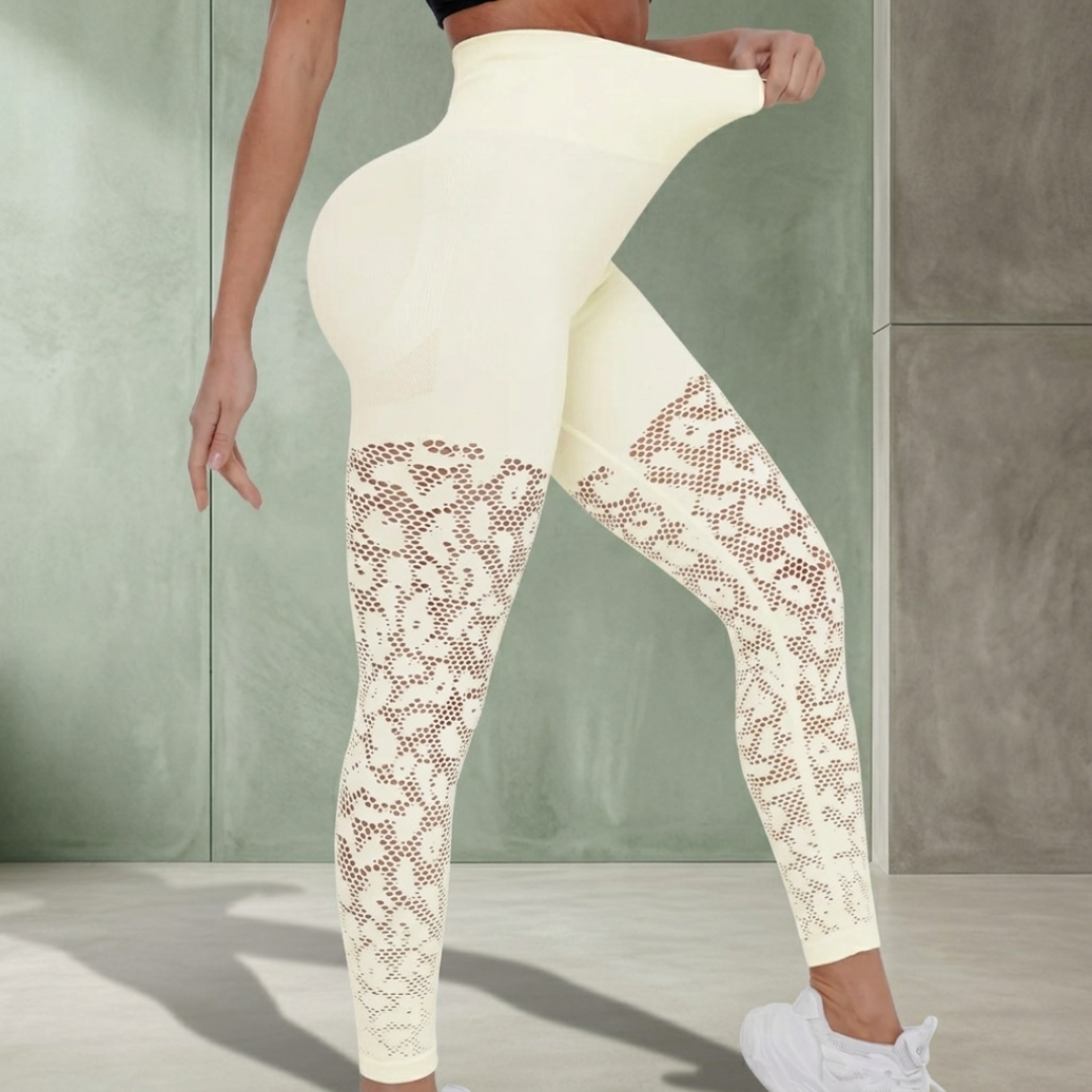 White leggings with lace detailing worn by a person against a neutral background