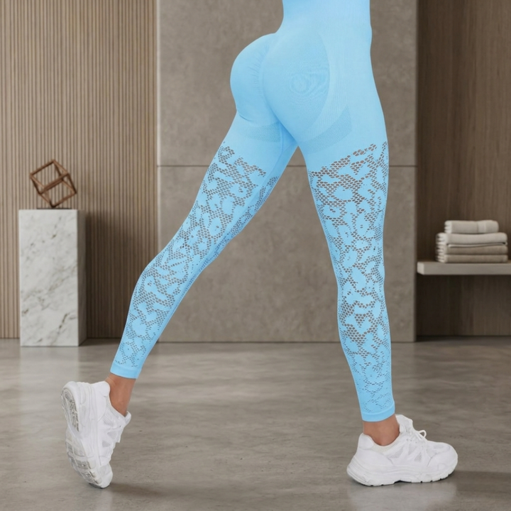 Light blue leggings with lace details worn by a person indoors.