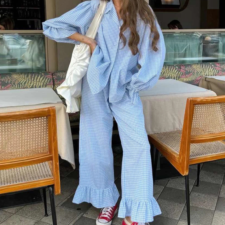 Person wearing a Blue Nova Sharp 2-Piece Set outfit with ruffled pants in an outdoor setting.