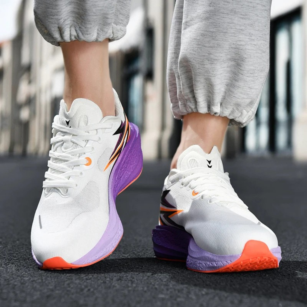 Purple Orion Thunder Run Carbon Racing Shoes worn by a person on a blurred street background