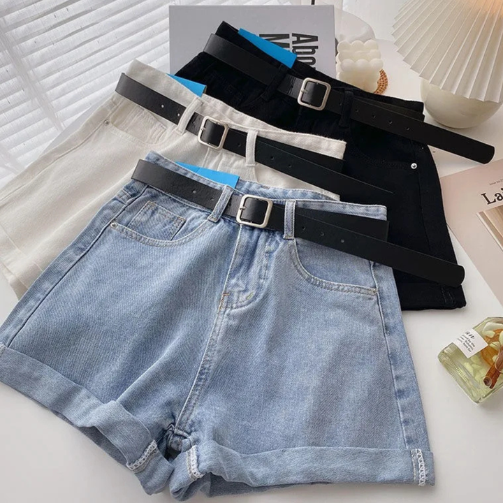 Outlaw Muse Wide-Leg Denim Shorts with black belts on a light surface