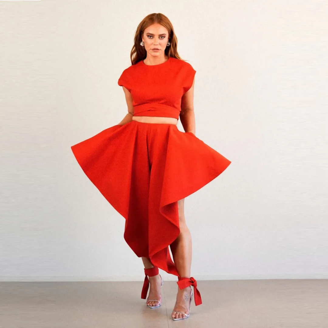 Woman wearing a red outfit with a white background