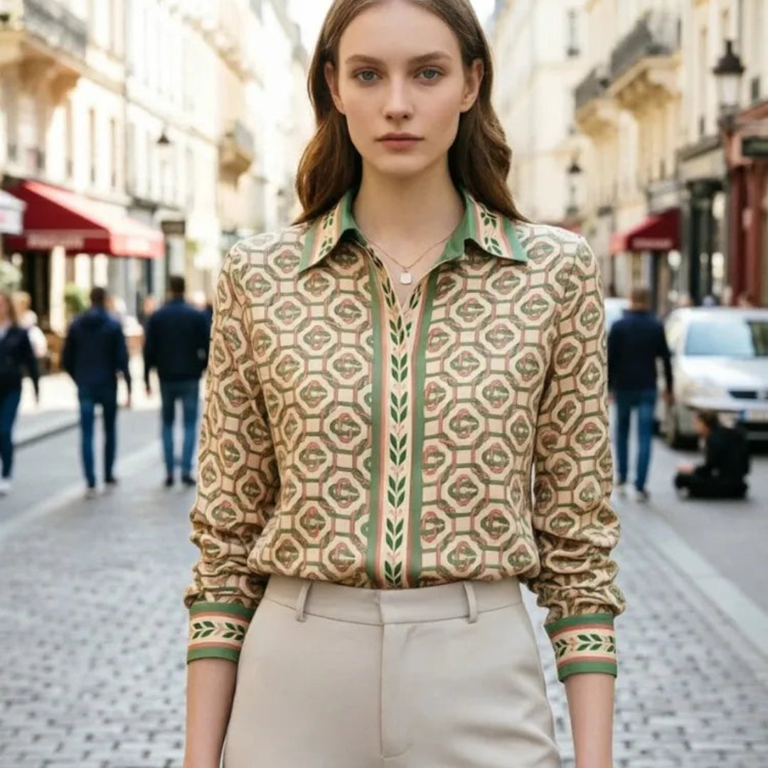 Woman wearing a patterned green shirt on a city street
