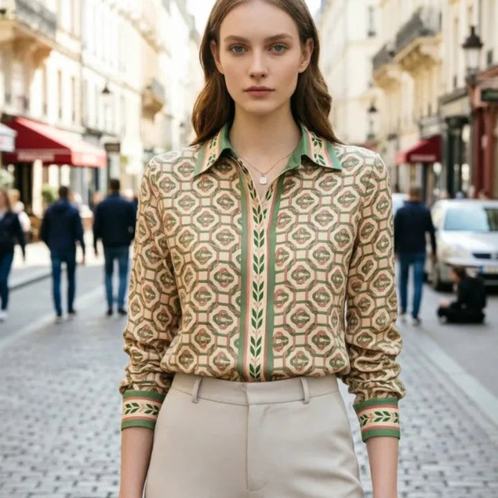 Woman wearing a patterned green shirt on a city street