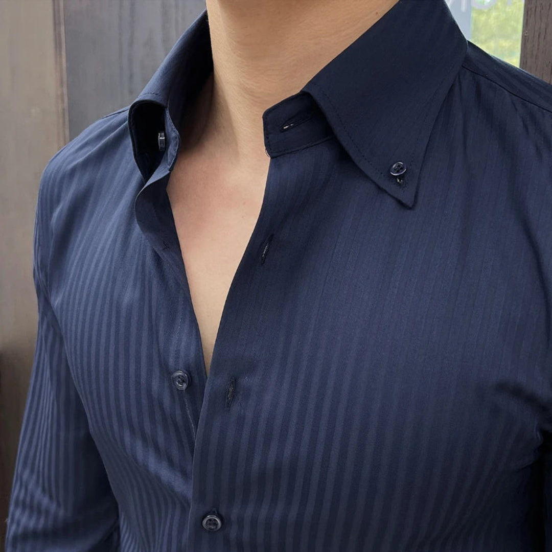 Blue striped shirt with a collar, worn by a person.