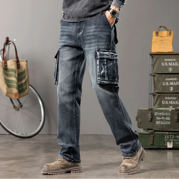 Person wearing retro blue jeans with cargo pockets in a casual setting with a bicycle and storage boxes.