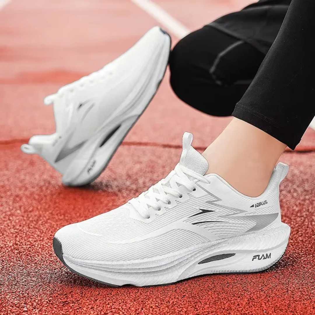 White Savage Flow Carbon Support Running Shoes on a red track