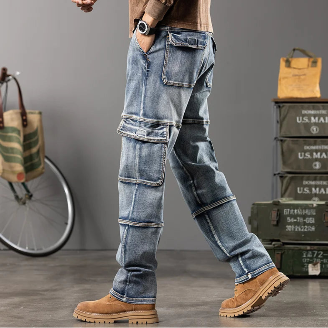 Person wearing blue jeans with a casual background featuring a bicycle and storage boxes.