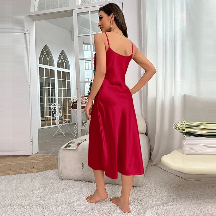 Woman wearing red Sienna Ice Satin Dream Dress in indoor setting.