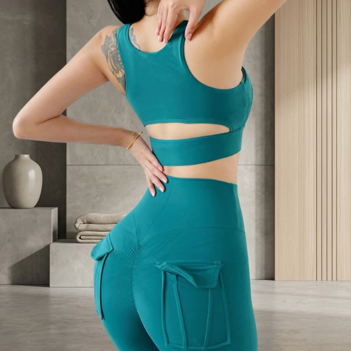 Person wearing a green athletic outfit in an indoor setting
