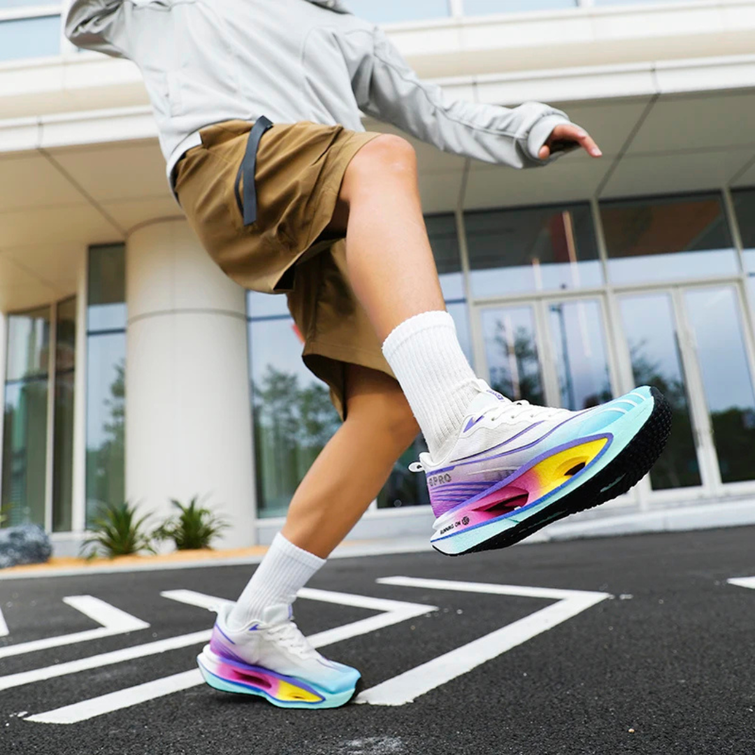 Person wearing Blue Purple Vortex Strike Carbon Running Shoes on a street with a building in the background