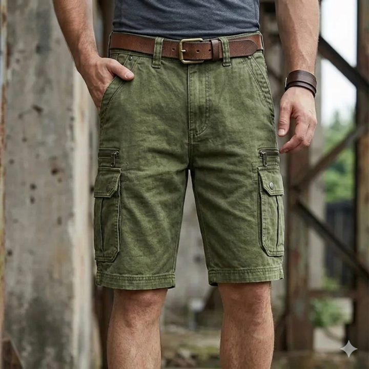 Person wearing green cargo shorts with a blurred background